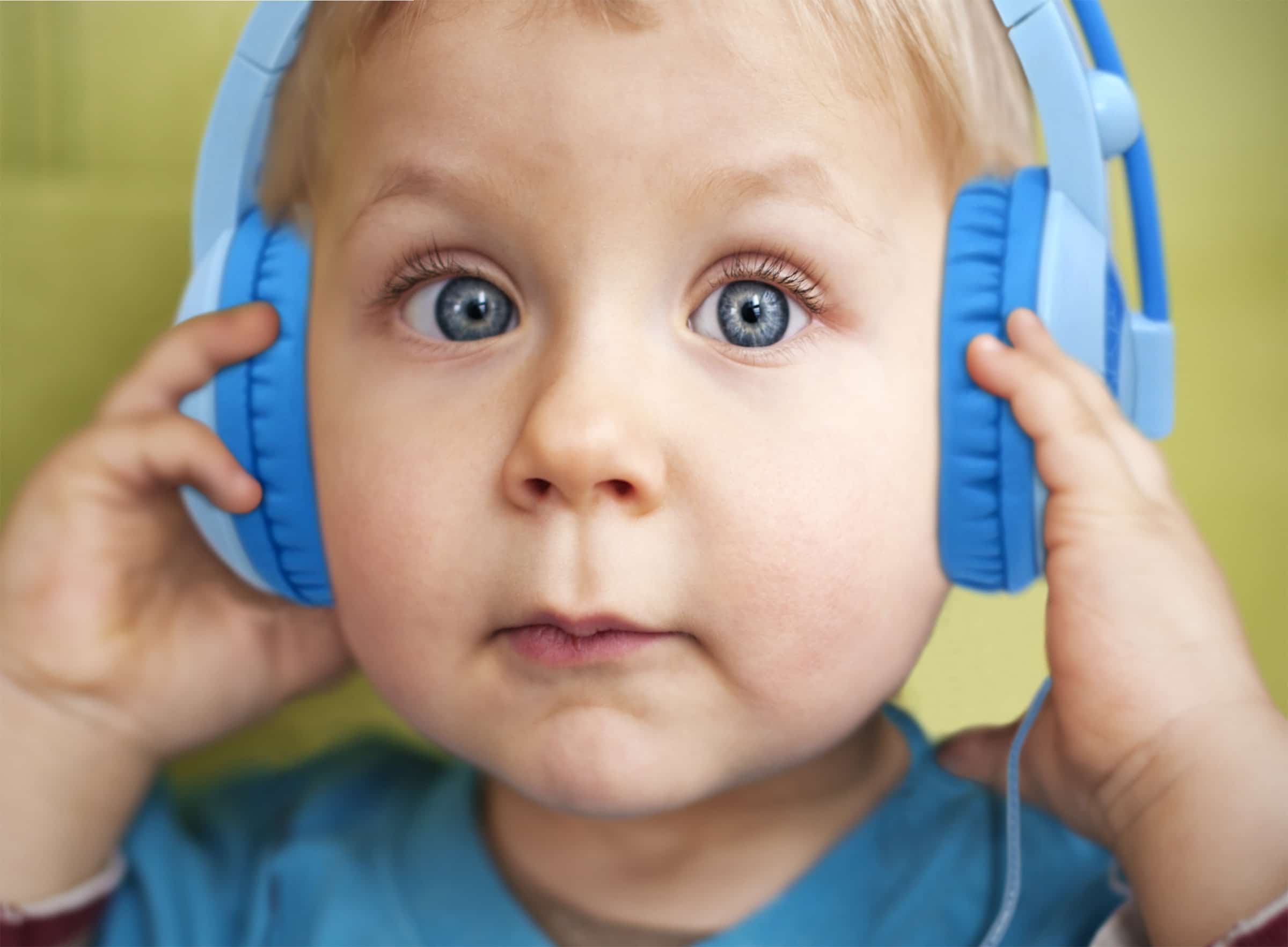Happy little boy listening to the music.