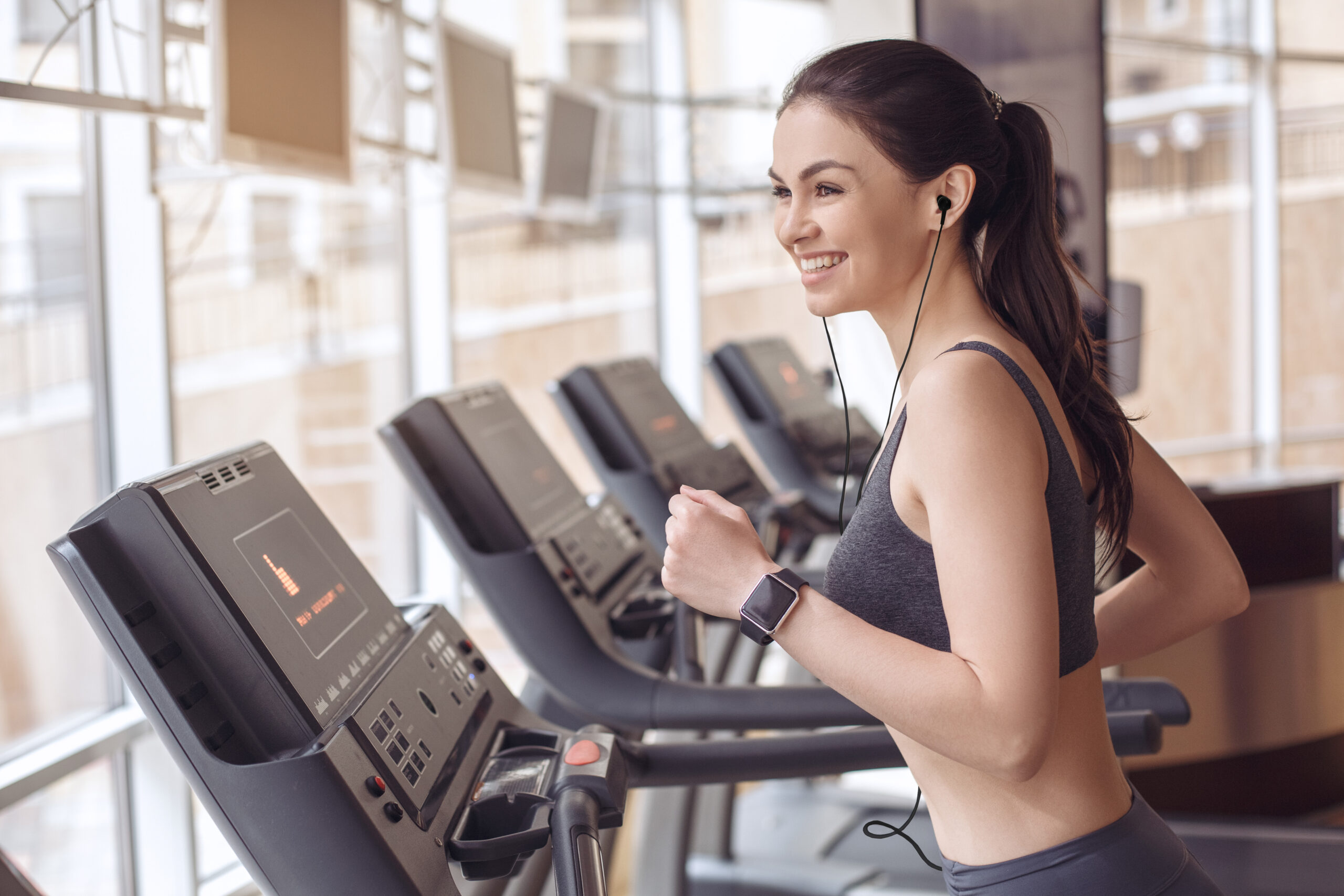 Young female training in gym healthy lifestyle treadmill